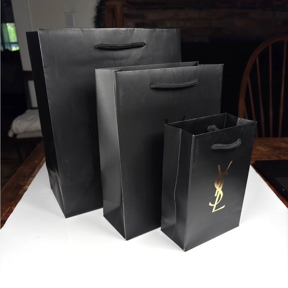 Yves Saint Laurent Black and Gold Gift Bag Set of Three.